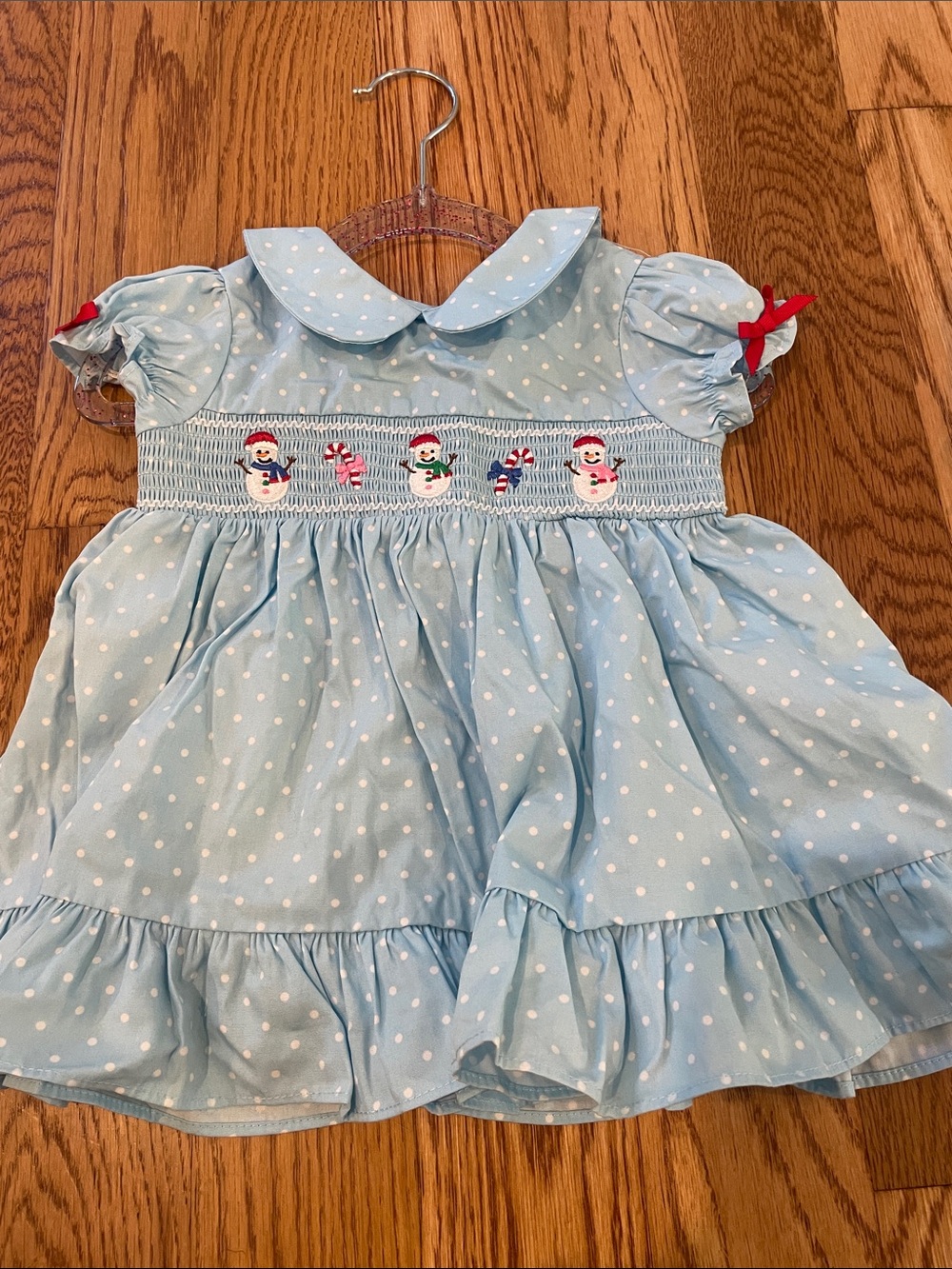 Good Lad Light Blue Polka Dot Dress with Snowman Smocking and Red Ribbon Accents